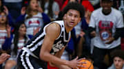Serra's Maximo Adams (25) looks to pass while guarded by Indio's Jerry Perkins (1) during the first quarter of their first-round CIF-SS playoff game at Indio High School in Indio, Calif., Wednesday, Feb. 7, 2024.