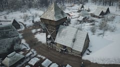 Manor Lords screenshot of a manor covered in snow.