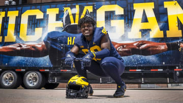 Four-star Palatine (Ill.) defensive lineman Jaylen Williams poses outside Michigan Stadiun while on an official visit with the Wolverines