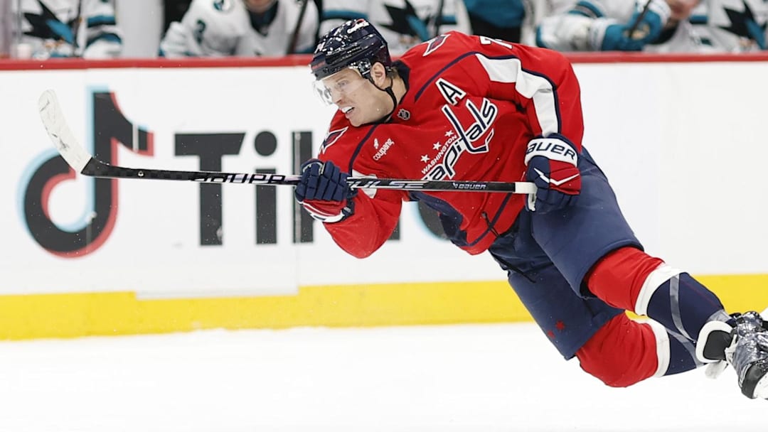 Jan 15, 2026; Washington, District of Columbia, USA; Washington Capitals defenseman John Carlson (74) shoots the puck against the San Jose Sharks during the third period at Capital One Arena. Mandatory Credit: Geoff Burke-Imagn Images