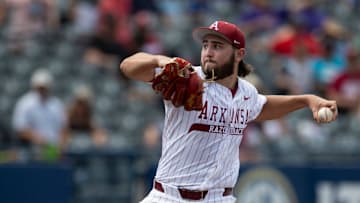 Arkansas Razorbacks' Zach Root (33) pitches as Arkansas Razorbacks take on Ole Miss Rebels during the SEC baseball tournament at Hoover Met in Birmingham, Ala., on Friday, May 23, 2025.