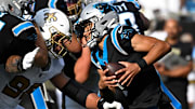 Nov 9, 2025; Charlotte, North Carolina, USA; Carolina Panthers quarterback Bryce Young (9) scrambles as New Orleans Saints defensive end Chase Young (99) pressures in the third quarter at Bank of America Stadium. 