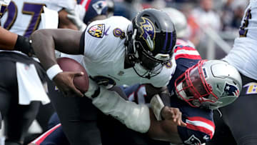 Deatrich Wise Jr. brings down Raven QB Lamar Jackson in the first quarter.