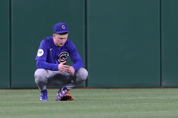 Cubs CF Pete Crow-Armstrong is visibly shaken as Pittsburgh Pirates medical personnel treat a fan who fell from the stands.