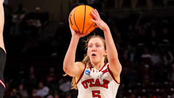 Mar 21, 2025; Columbia, South Carolina, USA; Utah Utes guard Gianna Kneepkens (5) attempts a three point basket over Indiana Hoosiers forward Karoline Striplin (11) in the second half at Colonial Life Arena. Mandatory Credit: Jeff Blake-Imagn Images