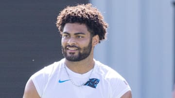 Carolina Panthers tight end Tommy Tremble works out on the sidelines during training camp. 
