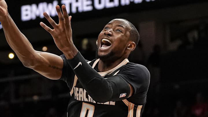 Mar 16, 2026; Atlanta, Georgia, USA; Atlanta Hawks forward Jonathan Kuminga (0) is called for an offensive foul on Orlando Magic guard Jalen Suggs (4) during the second half at State Farm Arena. Mandatory Credit: Dale Zanine-Imagn Images
