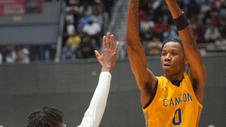 Canton's Jamarion Davis-Fleming (0) shoots over Yazoo City's Daveon Henry (15) during the MHSAA Class 5A basketball tournament championship Jackson, Miss., Friday, March 1, 2024.