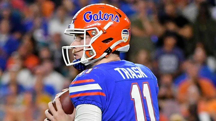 Dec 30, 2019; Miami Gardens, Florida, USA; Florida Gators quarterback Kyle Trask (11) drops back to attempt a pass against the Virginia Cavaliers during the first half at Hard Rock Stadium. Mandatory Credit: Jasen Vinlove-Imagn Images
