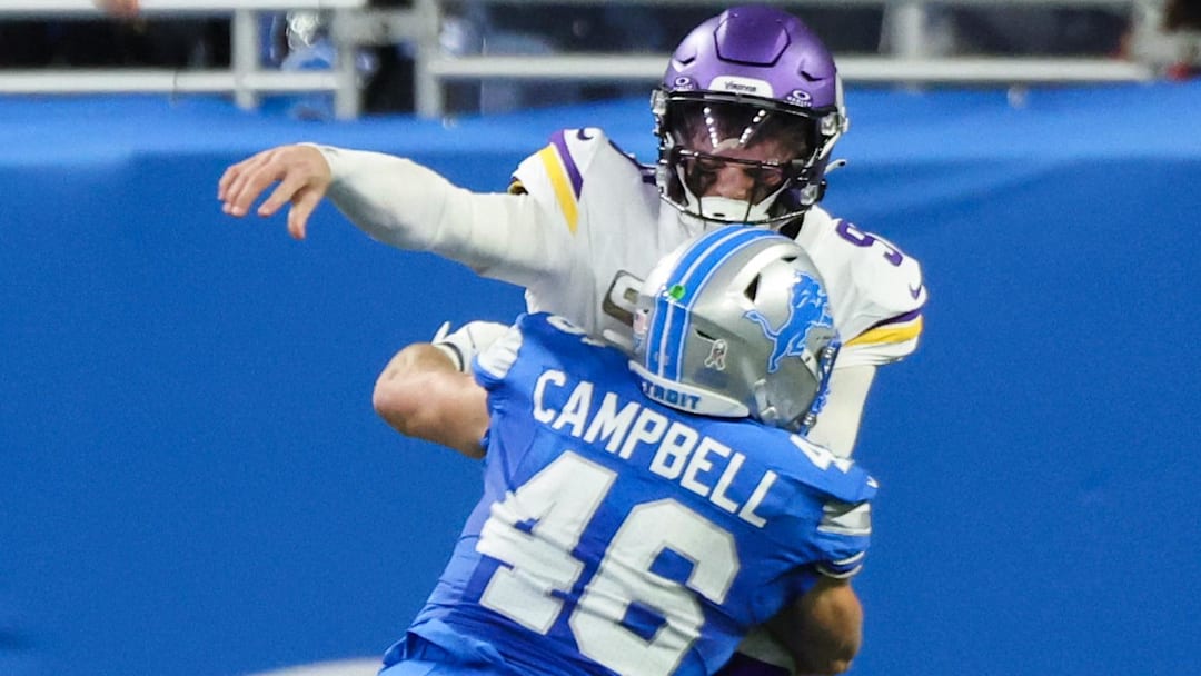 Minnesota Vikings quarterback J.J. McCarthy (9) is sacked by Detroit Lions linebacker Jack Campbell (46).