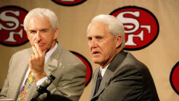 San Francisco 49ers head coach George Seifert (L) and former head coach Bill Walsh (R)