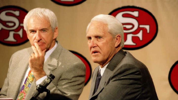 San Francisco 49ers head coach George Seifert (L) and former head coach Bill Walsh (R)