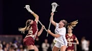 Boston College's Abby Herrod and Northwestern's Sam Smith vie for a draw control in a lacrosse game on February 15, 2025.