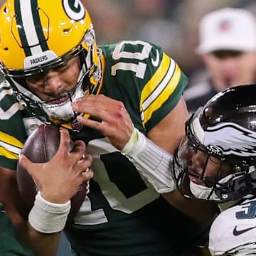 Green Bay Packers quarterback Jordan Love (10) is sacked by Philadelphia Eagles linebacker Nolan Smith Jr.