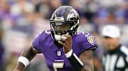 Baltimore Ravens quarterback Tyler Huntley scrambles with the ball against the Los Angeles Rams.