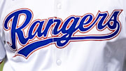 Texas Rangers logo on the front of a jersey.