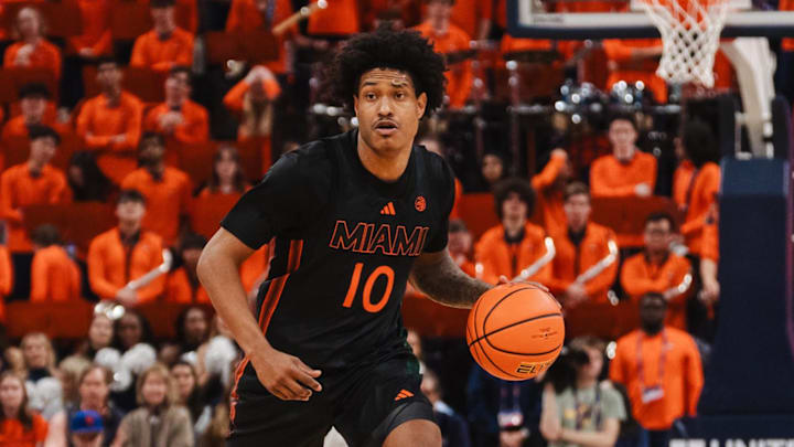 Feb 21, 2026; Charlottesville, Virginia, USA; Miami (FL) Hurricanes guard Tru Washington (10) brings the ball up court during the first half against the Virginia Cavaliers at John Paul Jones Arena. Mandatory Credit: Emily Faith Morgan-Imagn Images
