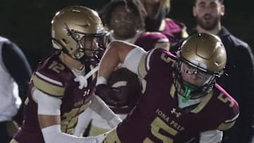 Crew Davis (5), a star running back at Iona Prep, is committed to play football and lacrosse at UNC.