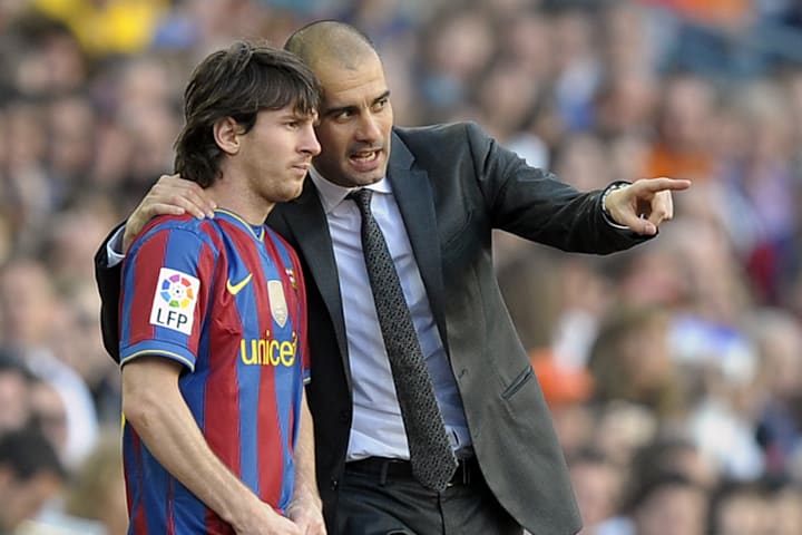 Barcelona's coach Pep Guardiola talks wi