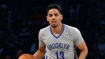 Apr 15, 2014; Brooklyn, NY, USA;  Brooklyn Nets guard Jorge Gutierrez (13) advances the ball during the third quarter against the New York Knicks at Barclays Center. New York Knicks won 109-98.  Mandatory Credit: Anthony Gruppuso-Imagn Images
