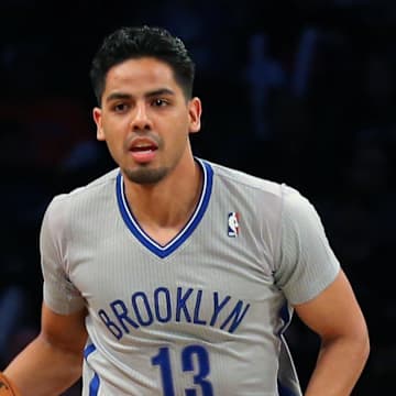 Apr 15, 2014; Brooklyn, NY, USA;  Brooklyn Nets guard Jorge Gutierrez (13) advances the ball during the third quarter against the New York Knicks at Barclays Center. New York Knicks won 109-98.  Mandatory Credit: Anthony Gruppuso-Imagn Images
