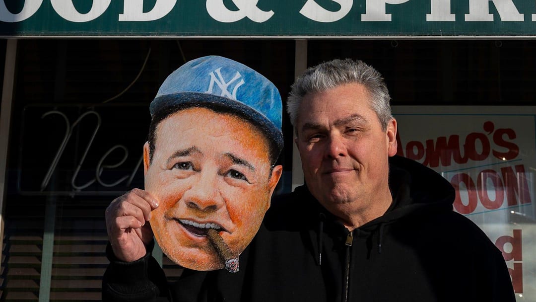 Tom Derry, 62, poses for a portrait holding a Babe Ruth face cutout outside Nemo’s bar in Detroit on Friday, Jan. 30, 2026. Derry is the founder of the Babe Ruth Birthday Bash, an annual celebration that has grown from a small gathering of friends into an event that draws hundreds.