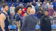 Queens-Florida Gulf Coast handshake line gets heated.