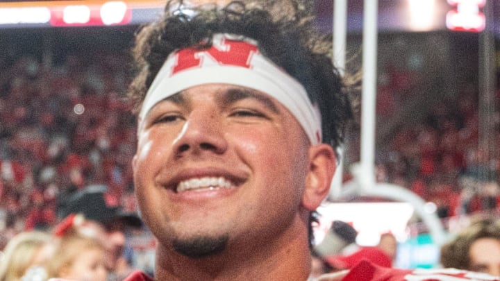 Nebraska Cornhuskers quarterback Dylan Raiola (15) takes a picture with fans after defeating the Wisconsin Badgers