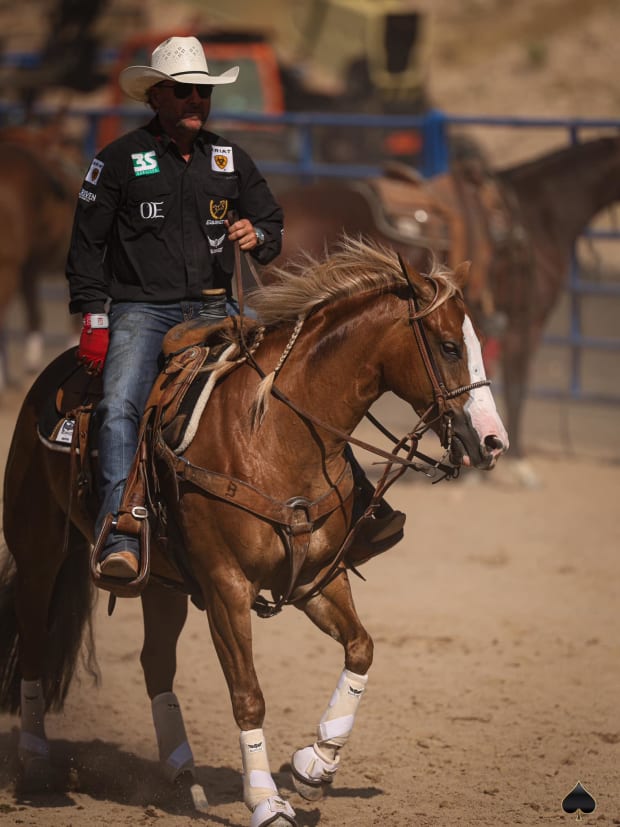 Trevor Brazile rides sorrel mare Gunna Wanna in an arena