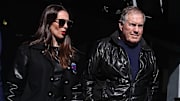 UNC football coach Bill Belichick and girlfriend Jordon Hudson enter a game between Notre Dame and Navy.