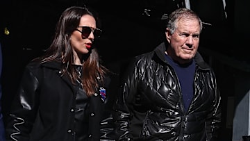 UNC football coach Bill Belichick and girlfriend Jordon Hudson enter a game between Notre Dame and Navy.