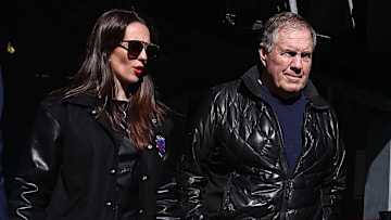 UNC football coach Bill Belichick and girlfriend Jordon Hudson enter the field before the game between Notre Dame and Navy.
