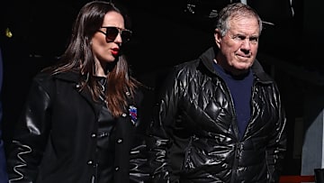 Oct 26, 2024; East Rutherford, New Jersey, USA; Former New England Patriots head coach Bill Belichick and girlfriend Jordon Hudson enter the field before the game between the Notre Dame Fighting Irish and the Navy Midshipmen at MetLife Stadium. Mandatory Credit: Vincent Carchietta-Imagn Images