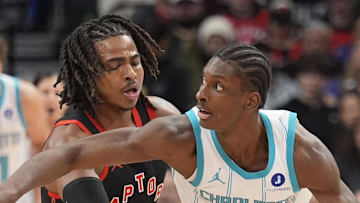 Charlotte Hornets forward Moussa Diabate drives to the net against Toronto Raptors forward Collin Murray-Boyles.