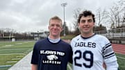 Two of St. Johns Prep players step in after the game to celeberate a victory