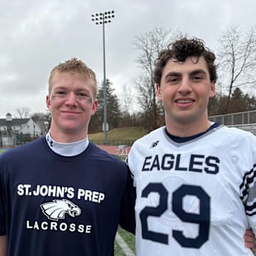 Two of St. Johns Prep players step in after the game to celeberate a victory