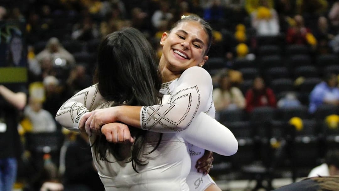 Mizzou Arena, January 16, 2026. Mizzou gymnast Amy Wier hugs coach Lacey Rubin after completing her beam routine.