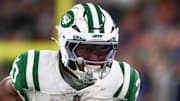 Oct 14, 2024; East Rutherford, New Jersey, USA; New York Jets running back Breece Hall (20) runs with the ball against the Buffalo Bills during the first half at MetLife Stadium. Mandatory Credit: Ed Mulholland-Imagn Images