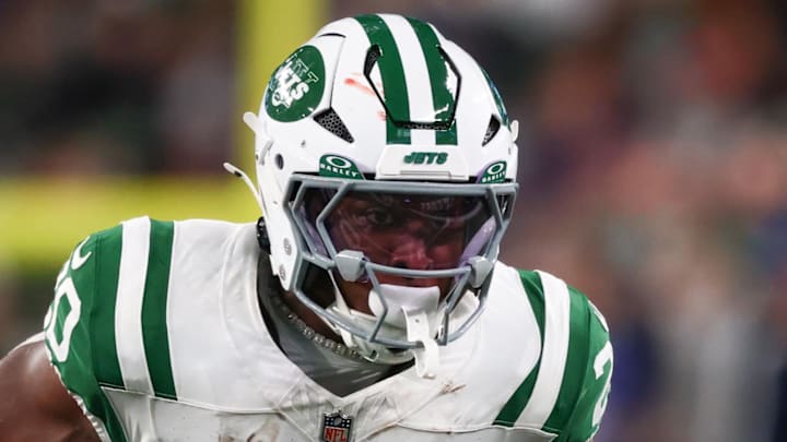 Oct 14, 2024; East Rutherford, New Jersey, USA; New York Jets running back Breece Hall (20) runs with the ball against the Buffalo Bills during the first half at MetLife Stadium. Mandatory Credit: Ed Mulholland-Imagn Images