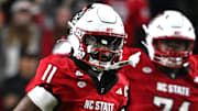 Nov 1, 2025; Raleigh, North Carolina, USA;  North Carolina State Wolfpack quarterback CJ Bailey (11) runs the ball during the first quarter against the Georgia Tech Yellow Jackets at Carter-Finley Stadium. Mandatory Credit: Zachary Taft-Imagn Images