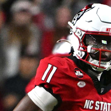 Nov 1, 2025; Raleigh, North Carolina, USA;  North Carolina State Wolfpack quarterback CJ Bailey (11) runs the ball during the first quarter against the Georgia Tech Yellow Jackets at Carter-Finley Stadium. Mandatory Credit: Zachary Taft-Imagn Images