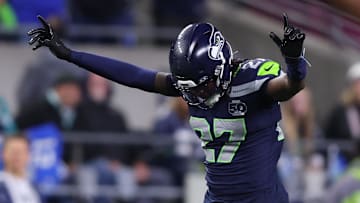 Oct 20, 2025; Seattle, Washington, USA; Seattle Seahawks cornerback Riq Woolen (27) celebrates after breaking up a pass during the fourth quarter against the Houston Texans at Lumen Field. Mandatory Credit: Kevin Ng-Imagn Images