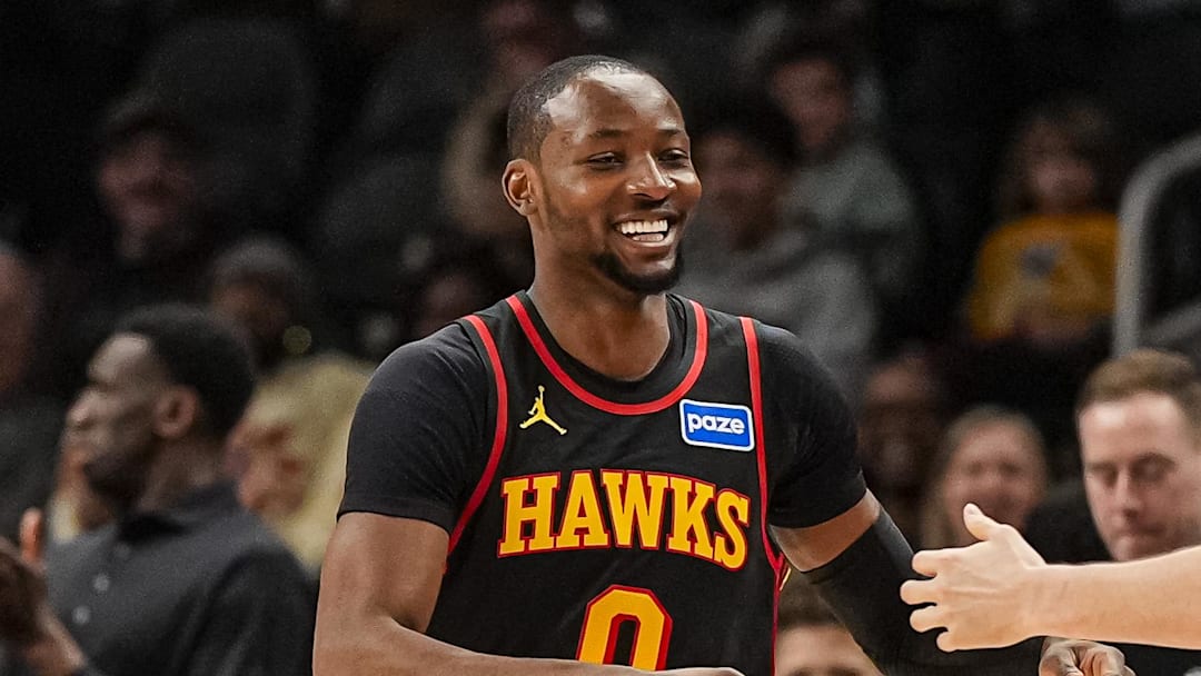 Feb 24, 2026; Atlanta, Georgia, USA; Atlanta Hawks forward Jonathon Kuminga (0) reacts with center Jock Landale (31) after scoring against the Washington Wizards during the first half at State Farm Arena. Mandatory Credit: Dale Zanine-Imagn Images