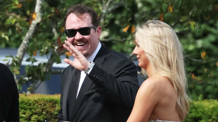 Comedian Shane Gillis waves to the spectators at the Olivia Culpo and Christian McCaffrey wedding at the Watch Hill Chapel and reception to follow at at the Ocean House in Westerly, RI on Saturday, June 29, 2024.