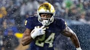 Notre Dame Fighting Irish running back Jadarian Price (24) runs against the Navy Midshipmen at Notre Dame Stadium. 