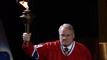 Oct 16, 2014; Montreal, Quebec, CAN; Canadiens former goalie Ken Dryden brings the torch before the game between the Boston Bruins and the Montreal Canadiens at the Bell Centre. Mandatory Credit: Eric Bolte-Imagn Images