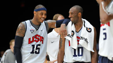 File photo: Former Team USA teammates Carmelo Anthony (15) and Kobe Bryant share a light moment following practice session for USA men's basketball team in Washington, DC.