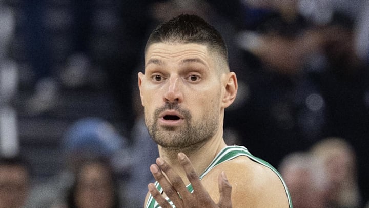 Feb 19, 2026; San Francisco, California, USA; Boston Celtics center Nikola Vucevic (4) looks to pass around Golden State Warriors guard De'Anthony Melton (8) during the first quarter at Chase Center. Mandatory Credit: D. Ross Cameron-Imagn Images