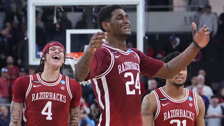 Mar 22, 2025; Providence, RI, USA; Arkansas Razorbacks forward Trevon Brazile (4), forward Billy Richmond III (24) and guard D.J. Wagner (21) celebrate after defeating the St. John's Red Storm in a second round men’s NCAA Tournament game at Amica Mutual Pavilion. Mandatory Credit: Gregory Fisher-Imagn Images