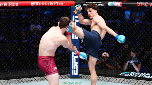 Quillan Salkilld kicks Gauge Young in a lightweight fight during Dana White's Contender Series 